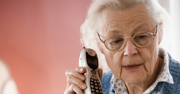Senior on Cordless Phone with ambiguous look