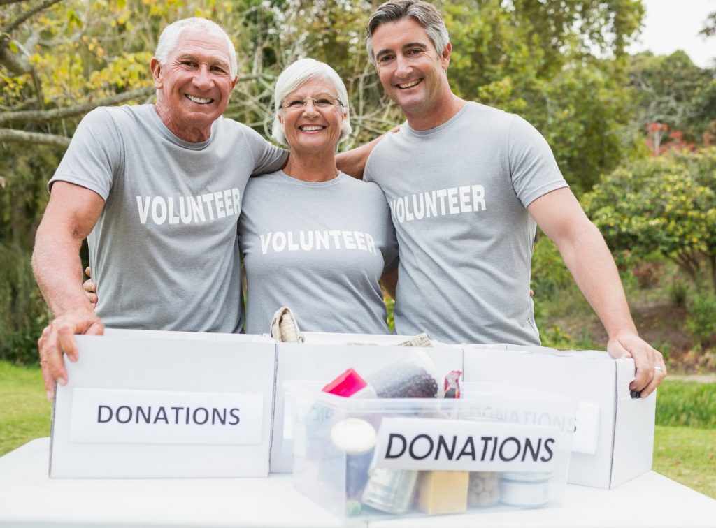 Happy family volunteer smiling at camera